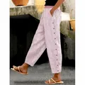 Women's pink striped casual pants with side button details in a comfortable loose fit - XS / Bottoms / Pink
