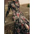 Detailed view of traditional floral print dress for Oktoberfest with vintage rose pattern - S / Black