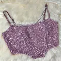 Pink sequin corset crop top featuring pearl and silver chain straps on white fur - L / Tops / Pink