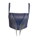 Detailansicht eines funkelnden blauen Bustier-Tops mit eleganten Silberkettenfransen - S / Oberteile / Lila