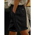 Detailed side view of black casual shorts featuring elegant lace hollow patchwork - S / Bottoms / Black