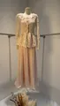 Detail of elegant beige lace peplum top and matching pleated maxi skirt set for women - XS / Top And Bottom / Pink