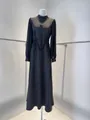 Detailed view of elegant French black maxi dress with mesh sleeves and lace floral accents - XS / Tops / Black