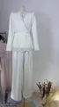Detailed view of elegant white pearl embellished V-neck top and wide-leg trousers - XS / Top And Bottom / Trousers Version / White