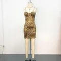 Sexy leopard print bodycon mini dress with spaghetti straps displayed on a mannequin. - XS / Top And Bottom / Bodycon Mini