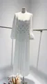 Detailed view of white satin maxi dress with rhinestone embellished waist and lantern sleeves - XS / Top And Bottom / White