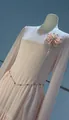 Close-up of elegant pink long-sleeved dress with beaded flower brooch detail - XS / Tops / Pink