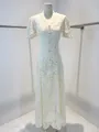 Full view of elegant white lace dress with fringe details on mannequin. - XS / Top And Bottom / Apricot