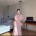 French style pink ruffled pleated dress with pearl belt shown in elegant bedroom setting - XS / Top And Bottom / Pink