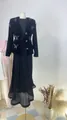 Close-up of black velvet jacket with 3D butterfly appliqués and pleated long skirt - XS / Top And Bottom / Black