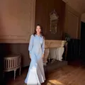 Detail view of a French-style light blue pleated maxi dress with slim-waist design - XS / Slim Fit Model / Light Blue