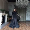 Elegant black evening gown featuring sheer cape sleeves and a flowing floor-length skirt. - XS / Top And Bottom / Black