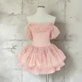 Detail showing pink lace puff sleeves and layered tulle skirt of a mini dress - S / Tops / Pink