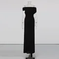 Close-up detail of the elegant black ruched off-shoulder dress with high waist design - S / Dresses / Black