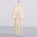 Front view of elegant ivory pleated maxi dress with lantern sleeves on mannequin - S / Top And Bottom / Apricot