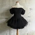 Detail of black off-shoulder mesh dress with boning corset and puff sleeves - S / Tops / Black