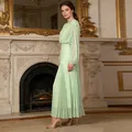 Elegant mint green pleated maxi dress with long sleeves in a luxurious vintage indoor room - S / Light Green