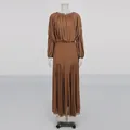 Detail of brown long-sleeved pleated maxi dress with elegant round neck design. - S / Coffee