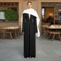 Elegant black long coat with white shawl collar and V-neck for a slim silhouette. - S / Tops / Black And White