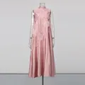 Detailed view of pink sleeveless maxi dress with 3D floral appliqués and A-line silhouette. - S / Bottoms / Pink