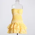 Detailed view of yellow hollow flower embroidery on a summer strapless mini dress - Yellow