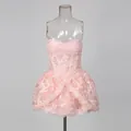 Detail of a pink lace embroidered strapless mini dress displayed on a clear mannequin. - S / Tops / Pink