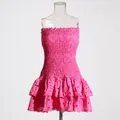 Close-up detail of hot pink smocked tube dress featuring tiered eyelet lace ruffles - S / Top And Bottom / Rose Red