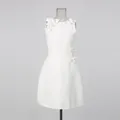 Close-up of white sleeveless dress with elegant 3D floral appliqués on shoulder - S / Top And Bottom / White