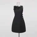 Close-up of black sleeveless dress featuring 3D floral appliques and round neckline - S / Top And Bottom / Black