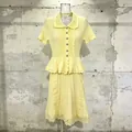 Front view of yellow knit dress with peplum waist and lace embroidery details - S / Yellow