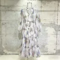 Detail of romantic floral dress with V-neck, lantern sleeves, and tiered hemline. - S / Top And Bottom / White