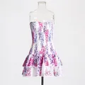Elegant floral print strapless mini dress featuring a smocked bodice and ruffled tiered hem - Purple
