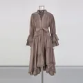 Close-up detail of a French style embroidered dress with lantern sleeves and waist tie - S / Top And Bottom / Brown