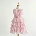 Close-up of a stylish pink sleeveless dress featuring tiered ruffles and high waist design - S / Pink
