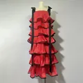 Close-up detail of a red tiered ruffle maxi dress with wide black ribbon shoulder straps - S / Tiered Style / Red
