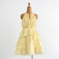 Elegant light yellow tiered ruffle sleeveless mini dress displayed on a wooden mannequin - S / Light Yellow