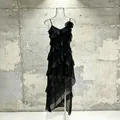 Elegant black sleeveless midi dress with cascading ruffles and floral accent detail - S / Tops / Black