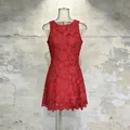Detailed view of an elegant red sleeveless floral lace mini dress presented on a mannequin. - S / Red