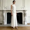 Detailed view of elegant white sleeveless dress with textured bodice and gold buckle - M / Top And Bottom / White