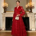 Elegant red lace maxi dress featuring floral brooch and belt in luxurious indoor setting - M / Top And Bottom / Red