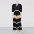 Detailed view of an elegant black V-neck pleated dress with white lace trim details - M / Top And Bottom / Black