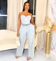Lifestyle shot of light wash denim corset top and wide-leg pants two-piece set - S / Top And Bottom / Light Blue