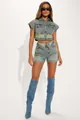 Model wearing trendy two-piece denim set with cropped jacket and V-waist shorts - S / Top And Bottom / Sky Blue