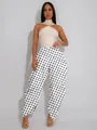 Close-up of high-waist black and white polka dot wide leg pants with pleated harem cut. - S / Bottoms / White