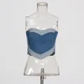 Detail view of a vintage washed denim tube top with a heart-shaped patchwork design. - S / Tops / Blue