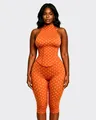 Vue détaillée d'une combinaison dos nu orange à pois avec une taille corsetée élégante - Orange