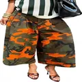 Detail view of stylish orange and green camouflage wide-leg cropped trousers - S / Bottom (Camouflage) / Orange