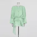 Elegant mint green mini dress with bubble sleeves, pleated bodice and ruffle detail. - Green