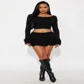 Completo nero in maglia a due pezzi con crop top a maniche lunghe e minigonna a frange - Taglia S / Top E Pantaloni / Nero