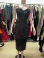 Dettaglio dell'abito da sera nero con perline pesanti e motivi a ventaglio in paillettes - XS / Top / Nero